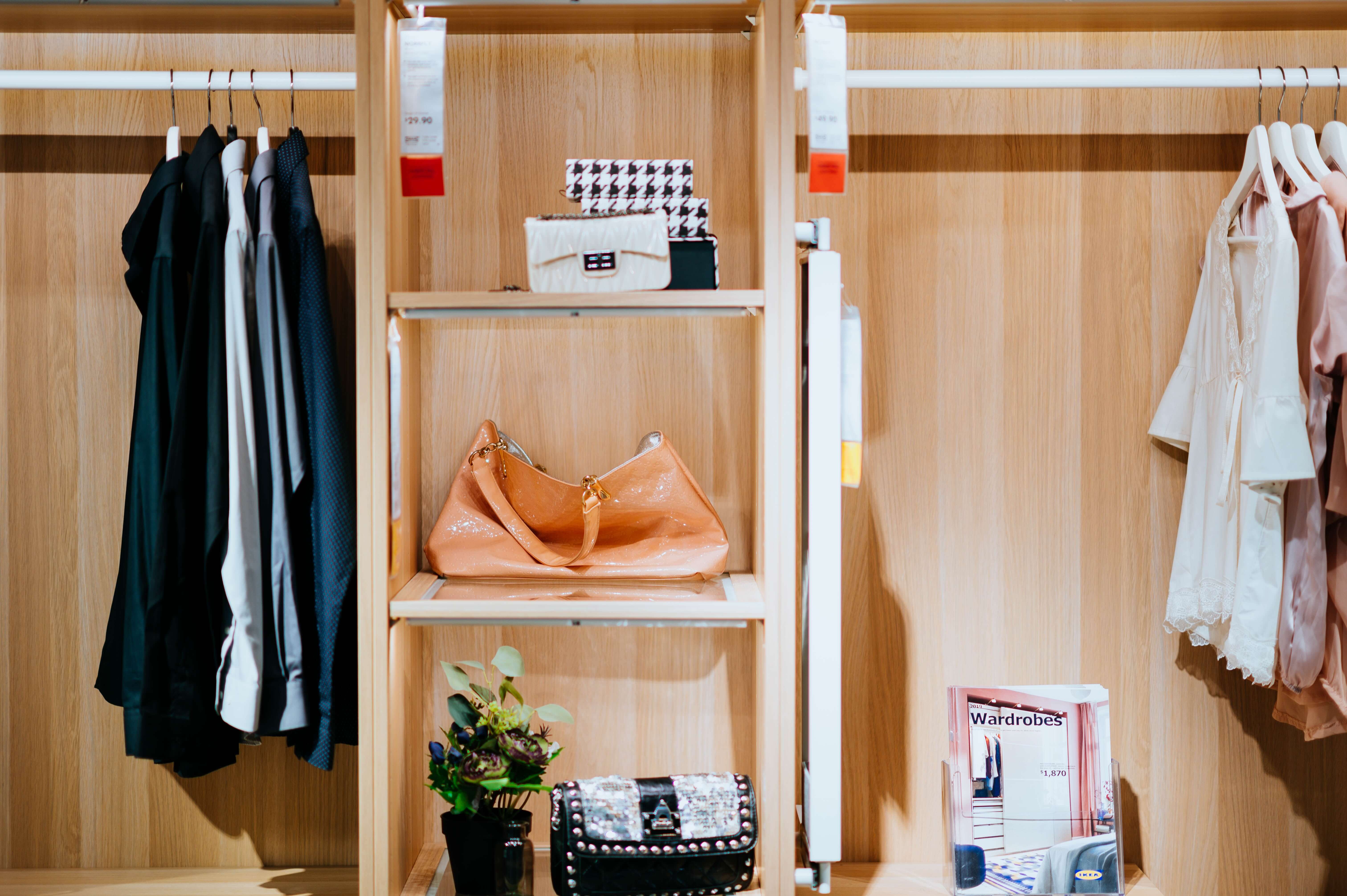 hanging clothes in a closet